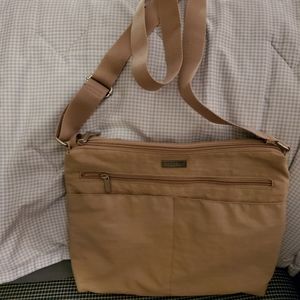 Beige Baggalini crossover bag.